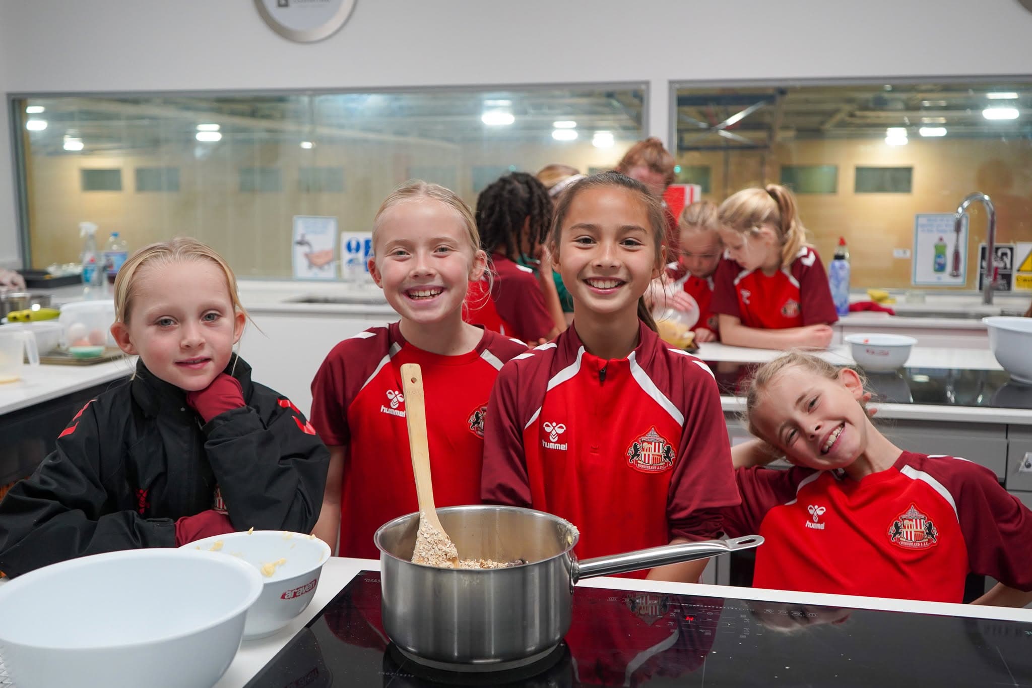 Young people smiling during a Foundation of Light activity session